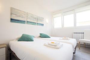 A bed or beds in a room at Olabide by Smiling Rentals
