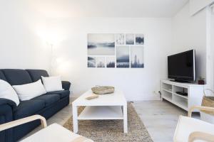 A television and/or entertainment centre at Olabide by Smiling Rentals