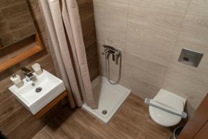 Koupelna v ubytování Abella Hotel