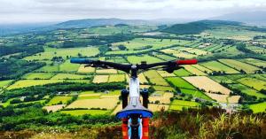 a bike parked on top of a hill overlooking a valley at Deebert House Hotel in Kilmallock