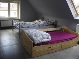 Een bed of bedden in een kamer bij Dunekitte