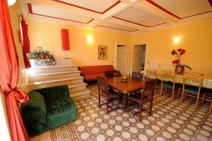a living room with a table and a dining room at La Casa di Angizia in Gagliano Aterno