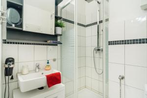 a bathroom with a sink and a shower at Hexe III in Altenau +37 photos