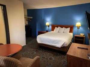 Postelja oz. postelje v sobi nastanitve Ventura Grand Inn