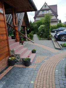 a set of pink stairs outside of a house at Willa u Magdy in Zakopane