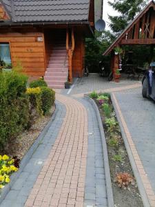 a brick path in front of a house at Willa u Magdy in Zakopane