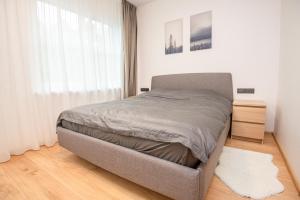 Postel nebo postele na pokoji v ubytování Kotedžas Voverė