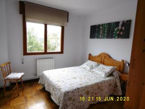 A bed or beds in a room at Apartamento Anjana