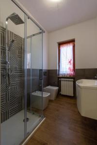 a bathroom with a shower and a toilet and a sink at Casa Vì - Toscana, Lunigiana, near Cinque Terre in Fivizzano