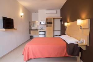Postel nebo postele na pokoji v ubytování Nova Hotel