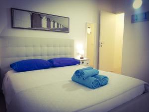 Postel nebo postele na pokoji v ubytování AlbaChiara B&B