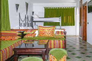 A bed or beds in a room at Hôtel Mandy