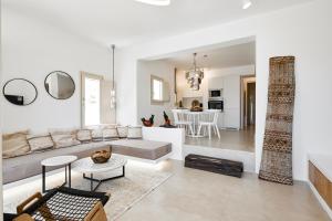 a living room with a couch and a table at Casa Luz in Pirgos