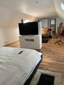 a living room with a flat screen tv on a wall at Casa Centru in Mediaş