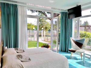 En eller flere senge i et værelse på Villa Marina