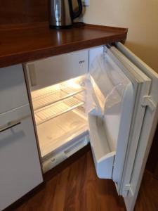 Kuchyň nebo kuchyňský kout v ubytování Apartament Holiday