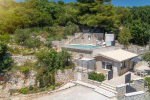 an aerial view of a house with a swimming pool at Sivota's Secret Villa in Sivota
