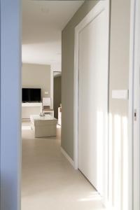 a hallway with a door leading to a living room at Sosiego Home in Puerto de Mazarrón