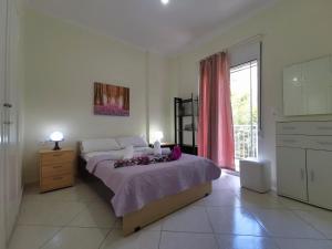 Posteľ alebo postele v izbe v ubytovaní Lefkada SunCentral Apartments