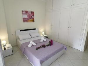 Posteľ alebo postele v izbe v ubytovaní Lefkada SunCentral Apartments