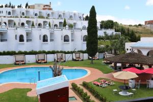 The swimming pool at or close to Hôtel Mandy