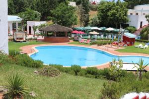 The swimming pool at or close to Hôtel Mandy