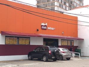 two cars parked outside of a mcdonalds restaurant at Studio 15 - centro Campinas in Campinas