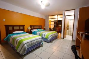 Postel nebo postele na pokoji v ubytování Hotel Bracamonte