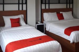 Lova arba lovos apgyvendinimo įstaigoje RedDoorz Plus @ Doorman Guest House
