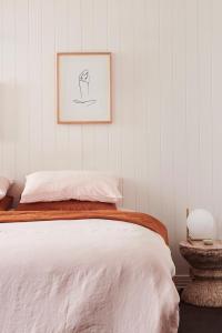 a bedroom with a bed and a picture on the wall at Anchor Geelong in Geelong