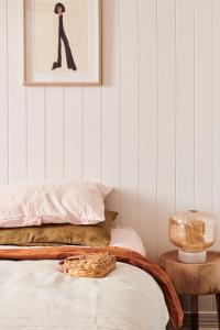 a bedroom with a bed and a picture on the wall at Anchor Geelong in Geelong