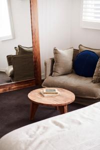 a living room with a couch and a coffee table at Anchor Geelong in Geelong