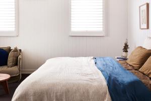 a bedroom with a bed and a couch at Anchor Geelong in Geelong