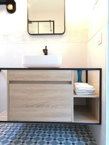 a bathroom with a sink and a mirror at Torre con vistas in Tossa de Mar