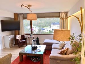 Een zitgedeelte bij Apartamento con encanto Puerto de Navacerrada