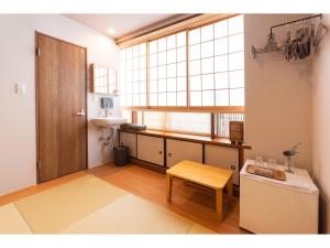 a bathroom with a sink and a toilet and a window at Oyado Kien Ryogoku in Tokyo +59 photos