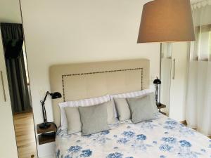 מיטה או מיטות בחדר ב-Apartamento con encanto Puerto de Navacerrada