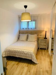 Säng eller sängar i ett rum på Apartamento con encanto Puerto de Navacerrada