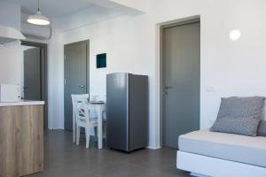 Kuchyň nebo kuchyňský kout v ubytování Amphitrite Suites Santorini
