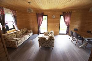 a living room with a couch and a table at Michałówka Zawoja in Zawoja