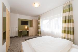 Postel nebo postele na pokoji v ubytování Hotel SCHNEIDER