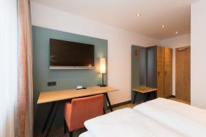 TV a/nebo společenská místnost v ubytování Hotel SCHNEIDER