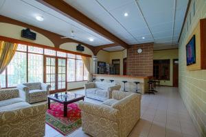 a large living room with couches and a table at Tobana Pejaten House in Jakarta