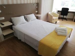 Posteľ alebo postele v izbe v ubytovaní Residencia Compostela