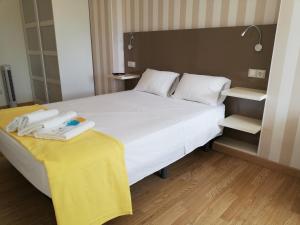 Posteľ alebo postele v izbe v ubytovaní Residencia Compostela