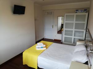 Posteľ alebo postele v izbe v ubytovaní Residencia Compostela