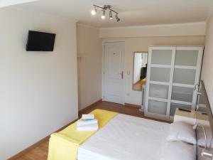 Posteľ alebo postele v izbe v ubytovaní Residencia Compostela