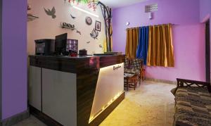 a kitchen with a counter in a room at Ratna Resort in Khandagiri