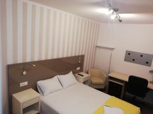 Posteľ alebo postele v izbe v ubytovaní Residencia Compostela