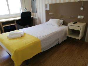Posteľ alebo postele v izbe v ubytovaní Residencia Compostela